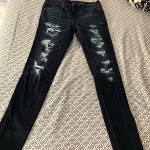 Dark wash ripped skinny jeans